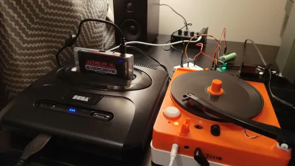 Retro gaming enthusiast attempts loading games to Sega Genesis from a vinyl...